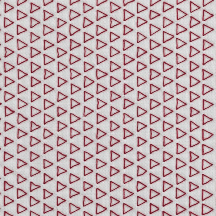 Many red stitched sashiko triangles on white cloth.
