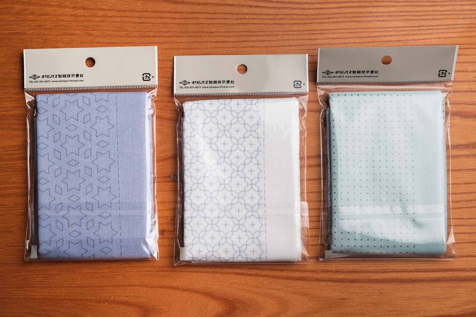 Three different pre-stenciled sashiko cloth packages by Olympus
