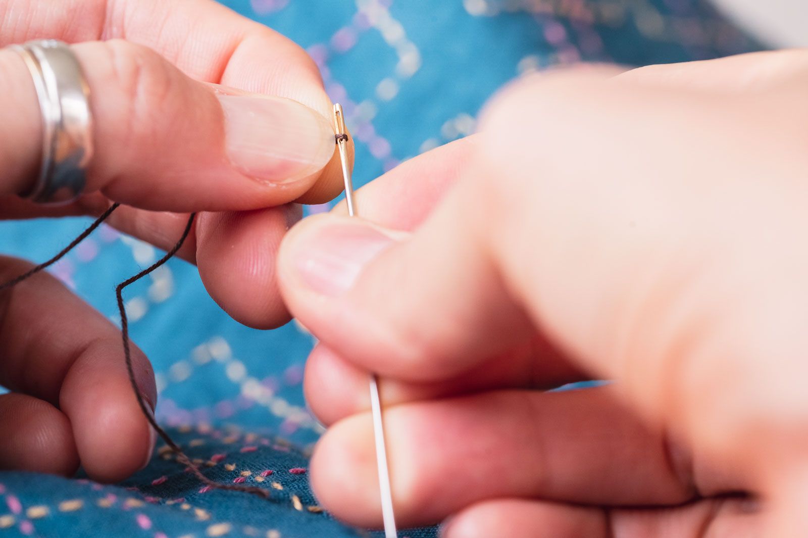 Sashiko needle with a tiny loop of thread created around it for easier threading