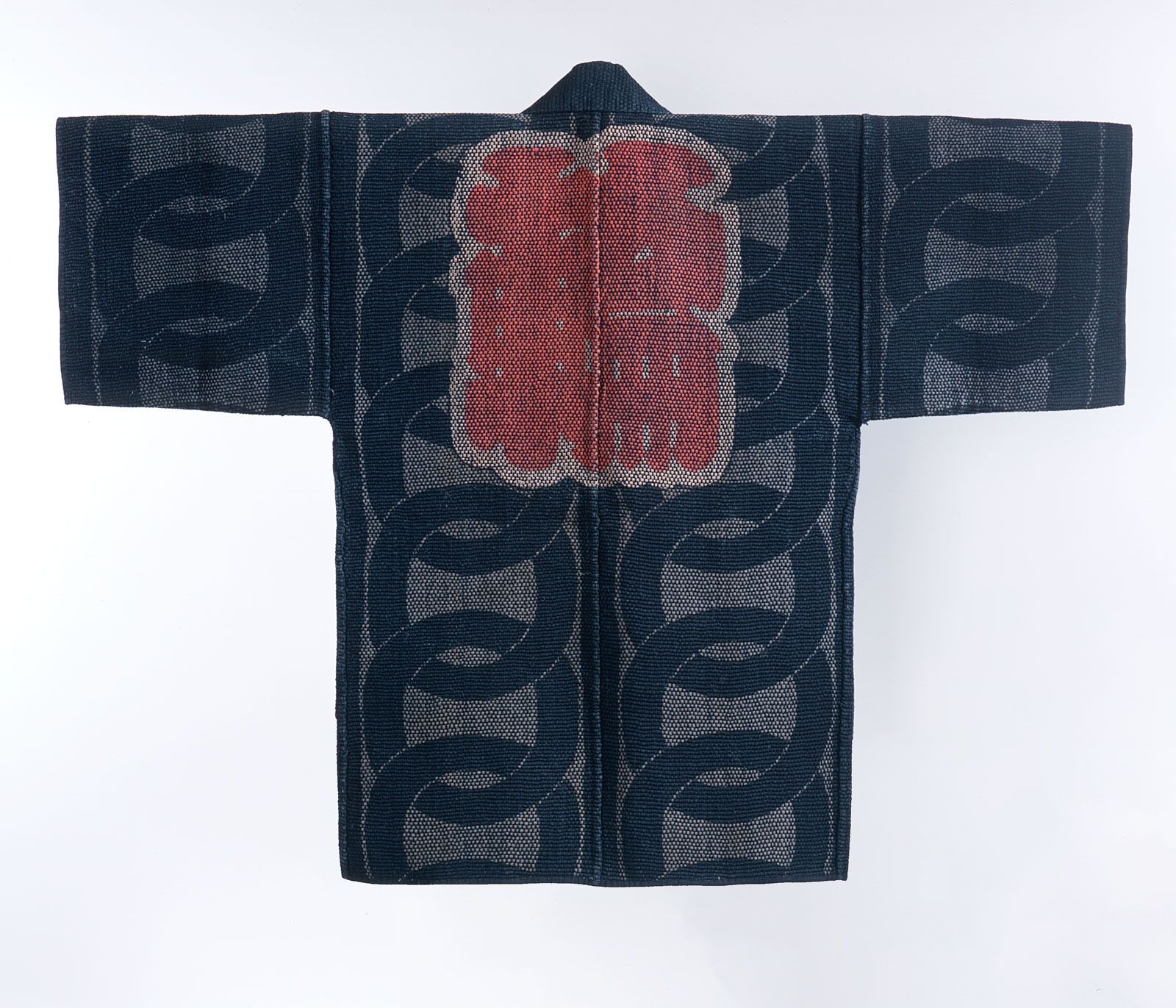 The jacket of a firefighter in Edo Japan, thousands of stitches form a beautiful design in blue, white and red