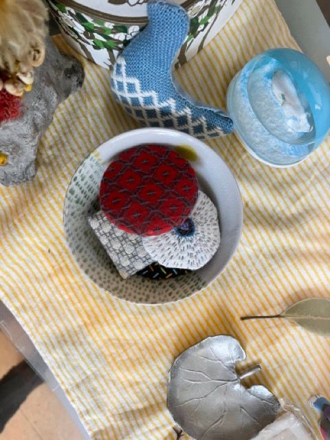 Sashiko and kogin goods on a shelf at Oomae Nunoten.