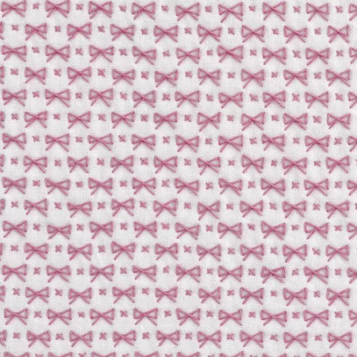 Sashiko pattern chōmusubi in pink on white fabric